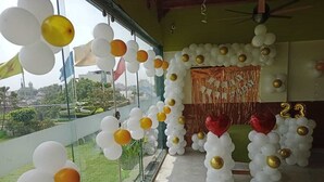 A decorated indoor space with a view of a green landscape. - Hotel Banaras Haveli (Varanasi)