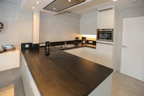 Microwave, stovetop, dishwasher, coffee/tea maker