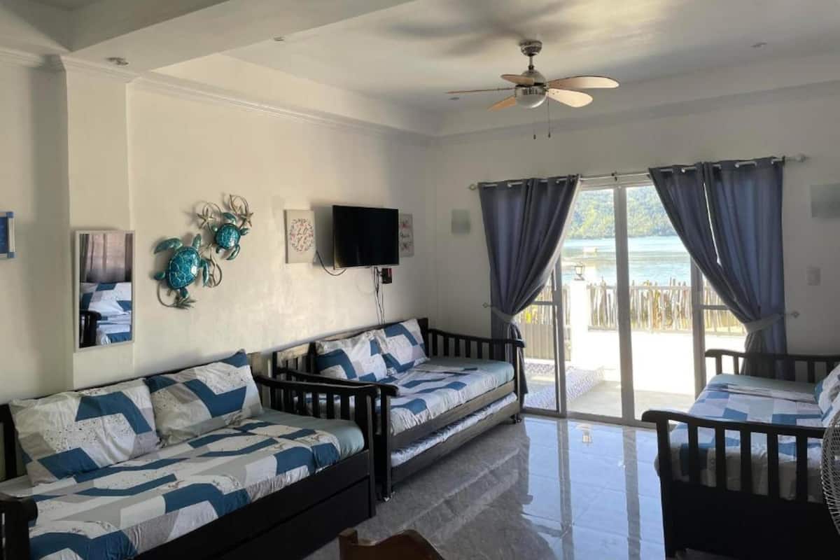 Signature villa, 1 slaapkamer, uitzicht op strand, aan het strand | Woonkamer