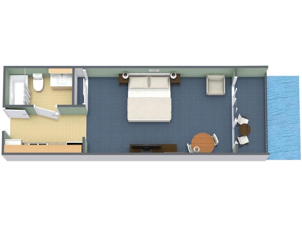 A room layout with a bed, a small table, a sofa, a window, and a bathroom.