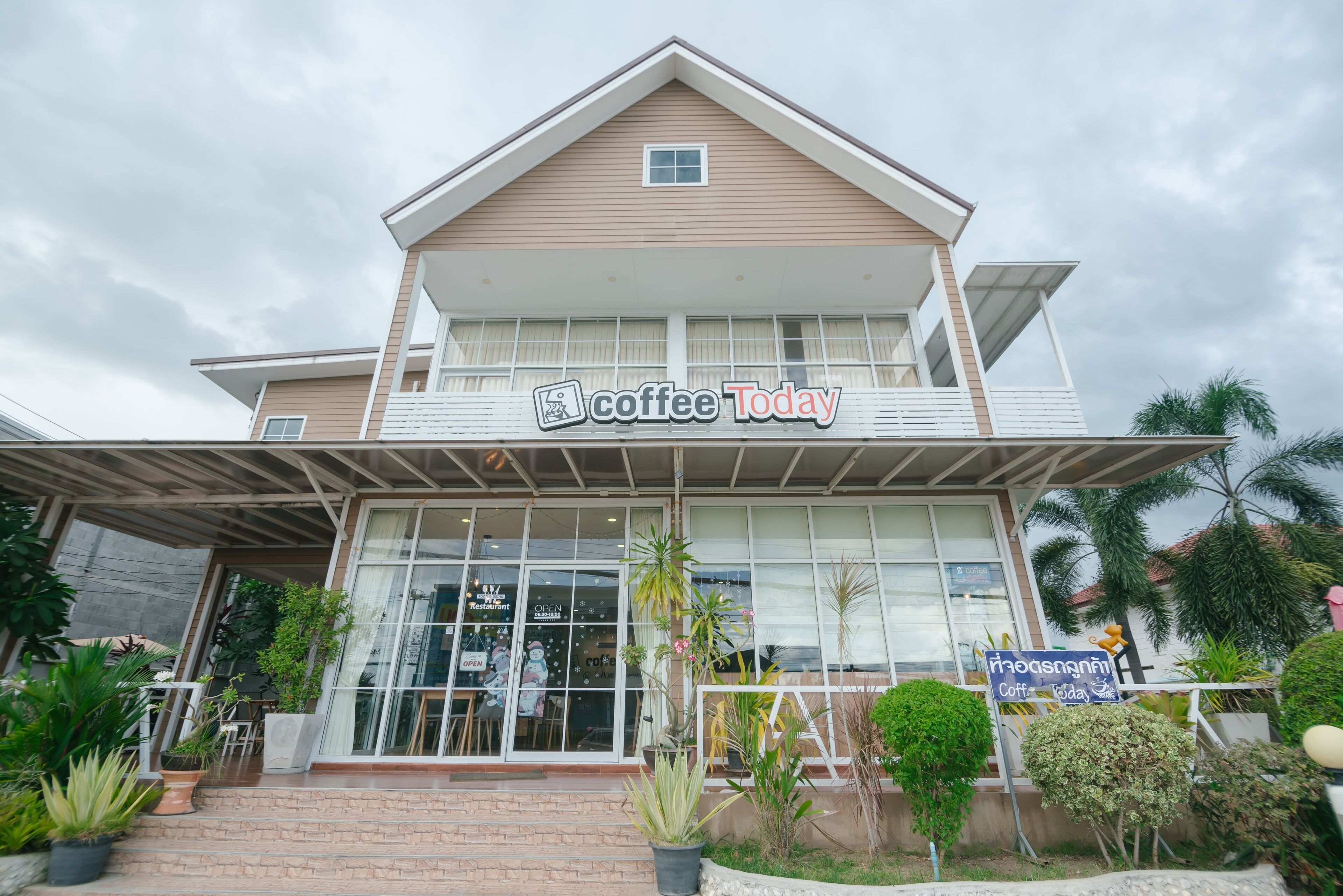 A two-story building with a sign reading "Coffee Today" on the front.