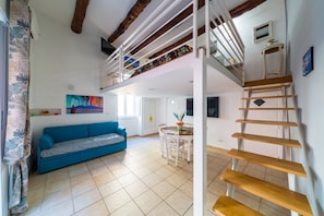 Family Loft | Living area | 32-inch LCD TV with satellite channels - Toledo house Apartments (Naples)