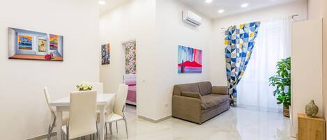 Deluxe Apartment | Living area | 32-inch LCD TV with satellite channels