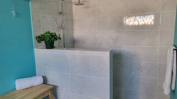 Shower, rainfall showerhead, hair dryer (on request), bathrobes
