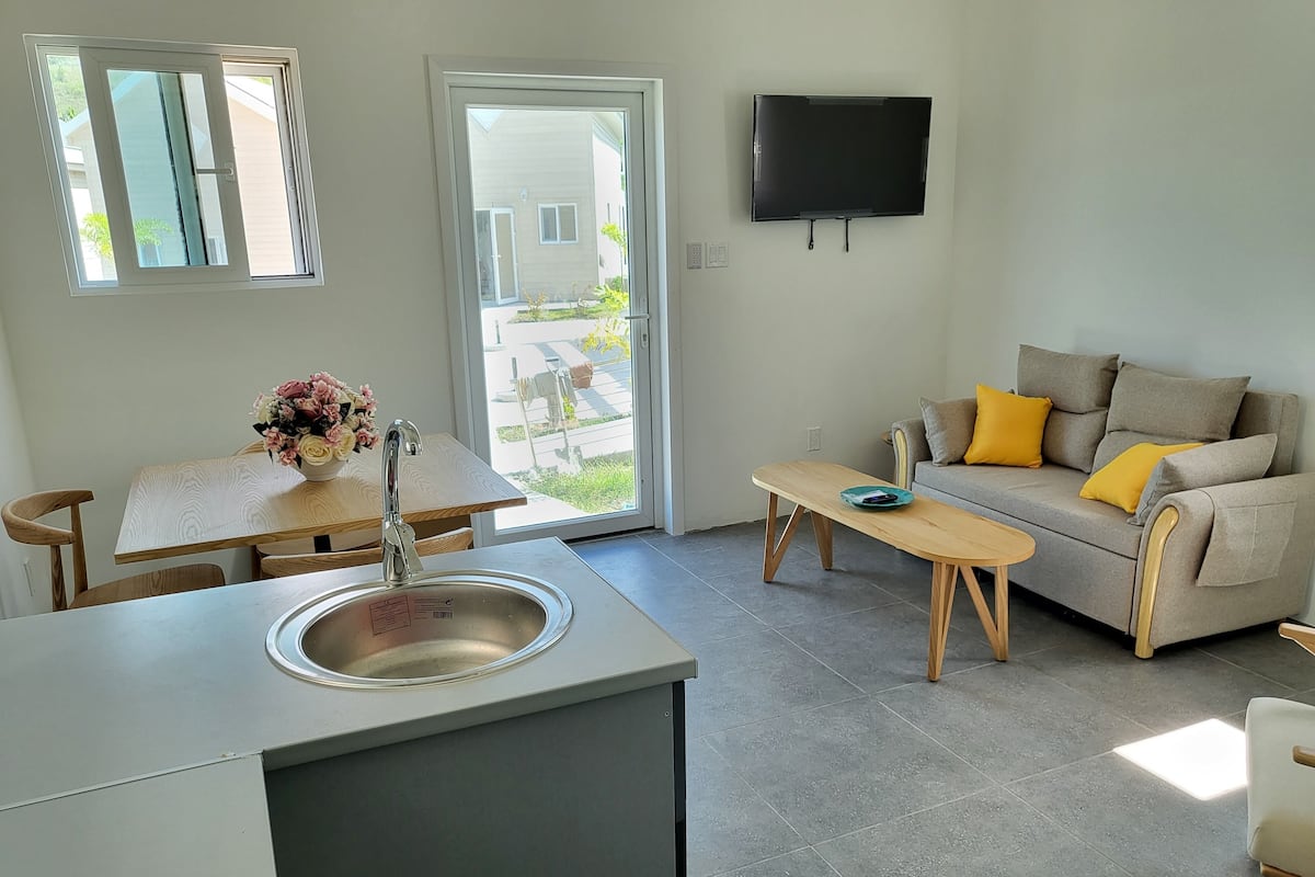 Deluxe Villa | Living area | Smart TV, books, streaming services
