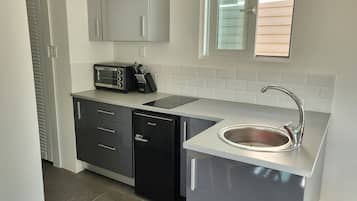 Deluxe Villa | Private kitchen | Mini-fridge, stovetop, electric kettle, toaster