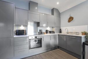Apartment | Private kitchen | Full-size fridge, microwave, oven, stovetop