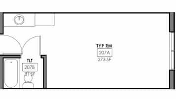 Distribución de una habitación de hotel con inodoro (207B), lavamanos (207A) y espejo (TYP RM).