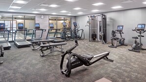 A gym with treadmills, elliptical machines, and a weight machine. - Fairfield Inn & Suites by Marriott Decatur (Decatur)