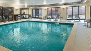 An indoor swimming pool with lounge chairs and a view of the city. - Fairfield Inn & Suites by Marriott Decatur (Decatur)