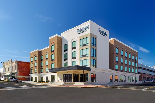 A Fairfield hotel with a modern architectural design, featuring a prominent entrance and multiple floors.