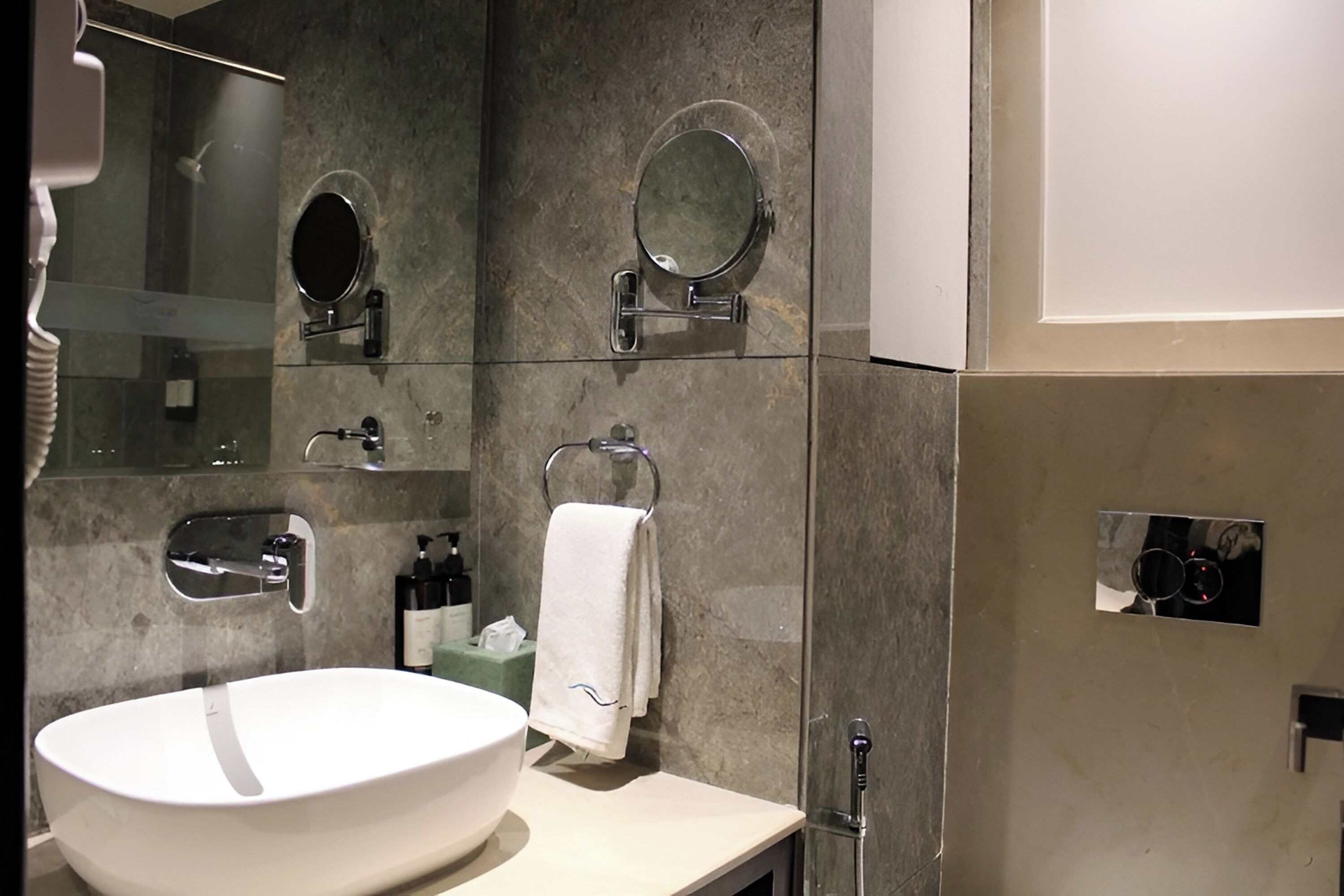 deluxe room | bathroom | shower, hair dryer, slippers, towels