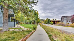 A residential street with houses, a sidewalk, and trees. - Steamboat Springs Condo Near Ski Resort & Village! (Steamboat Springs)