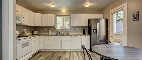 Coffee/tea maker, fridge, microwave, oven