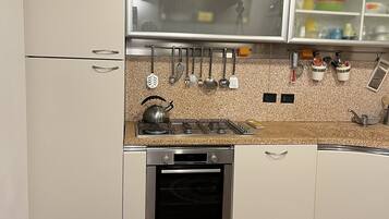 Villa | Private kitchen | Full-size fridge, oven, stovetop, dishwasher