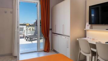 Deluxe Room, 1 King Bed, Terrace, Partial Sea View | 1 bedroom, down duvets, memory-foam beds, in-room safe
