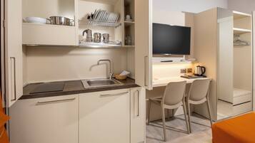 Deluxe Room, 1 King Bed, Terrace, Partial Sea View | 1 bedroom, down duvets, memory-foam beds, in-room safe