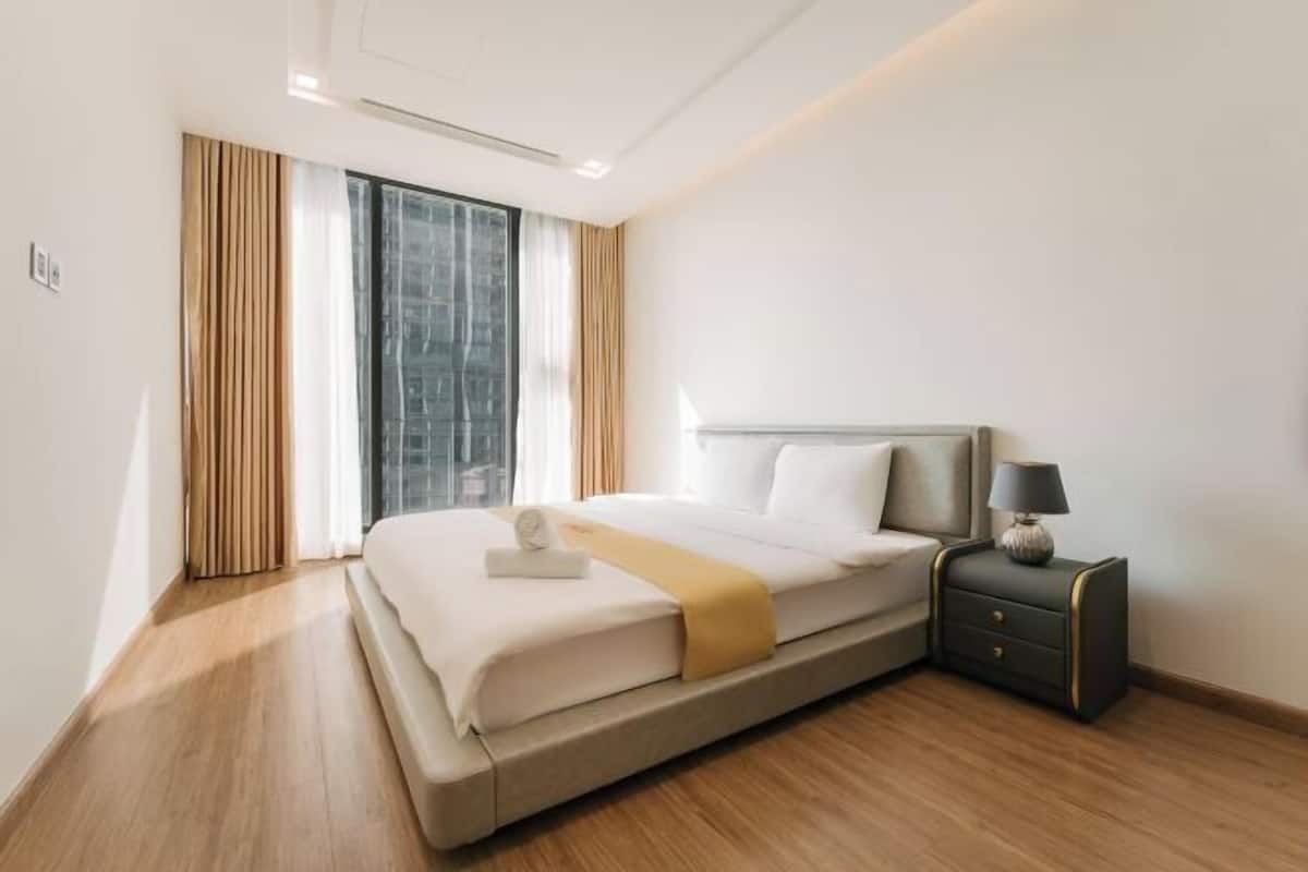 Premium bedding, desk, laptop workspace, blackout curtains