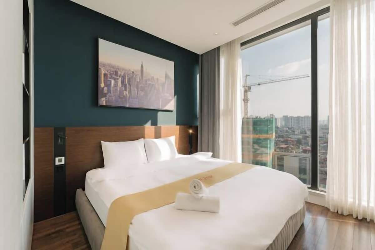 Premium bedding, desk, laptop workspace, blackout curtains