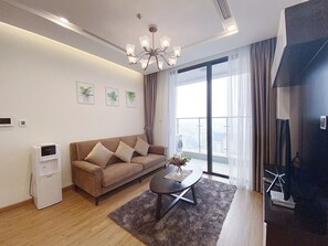 Apartemen, 1 kamar tidur | Area keluarga | Smart TV 55-inci dengan saluran TV kabel, perapian, dan film berbayar