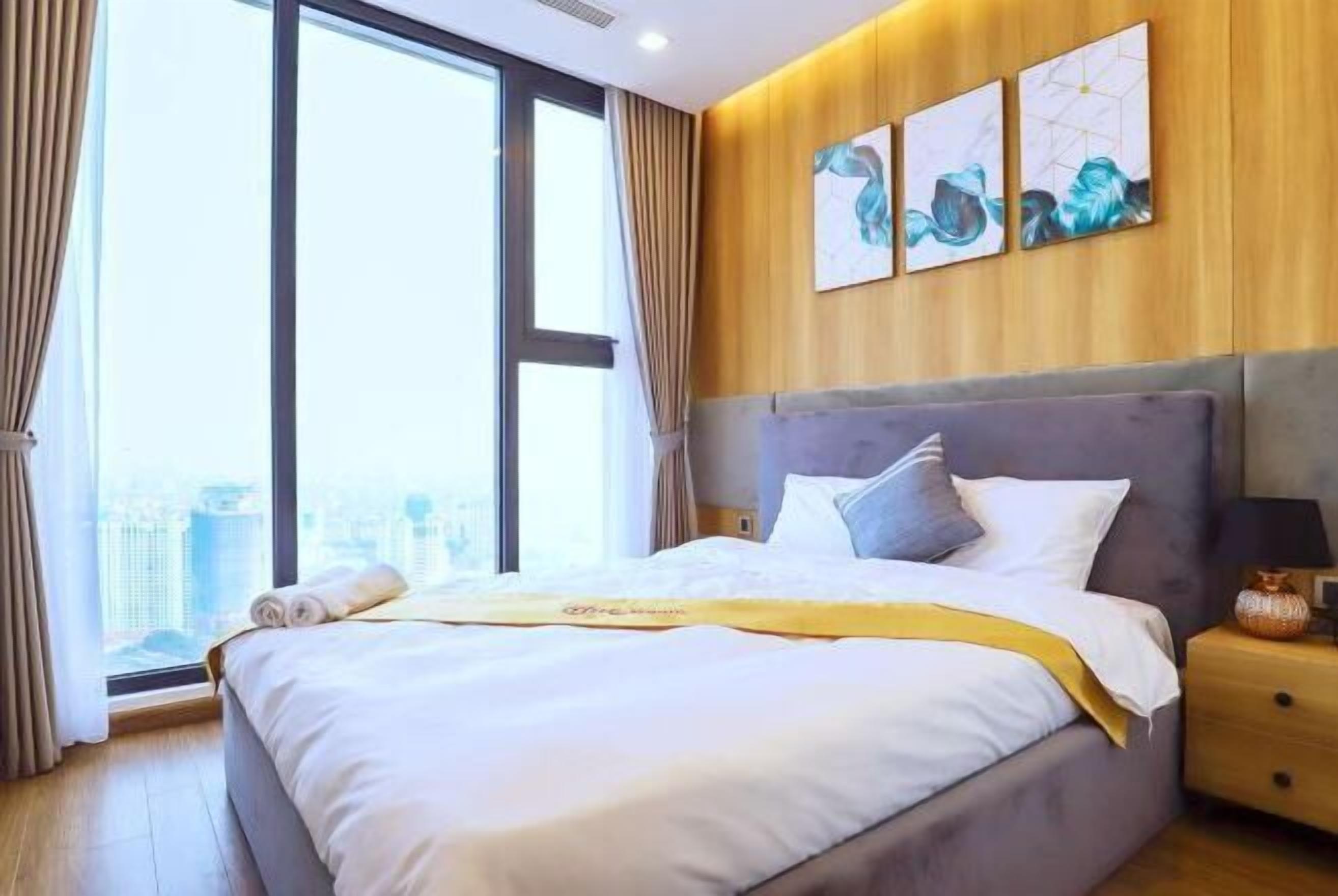 Premium bedding, desk, laptop workspace, blackout drapes