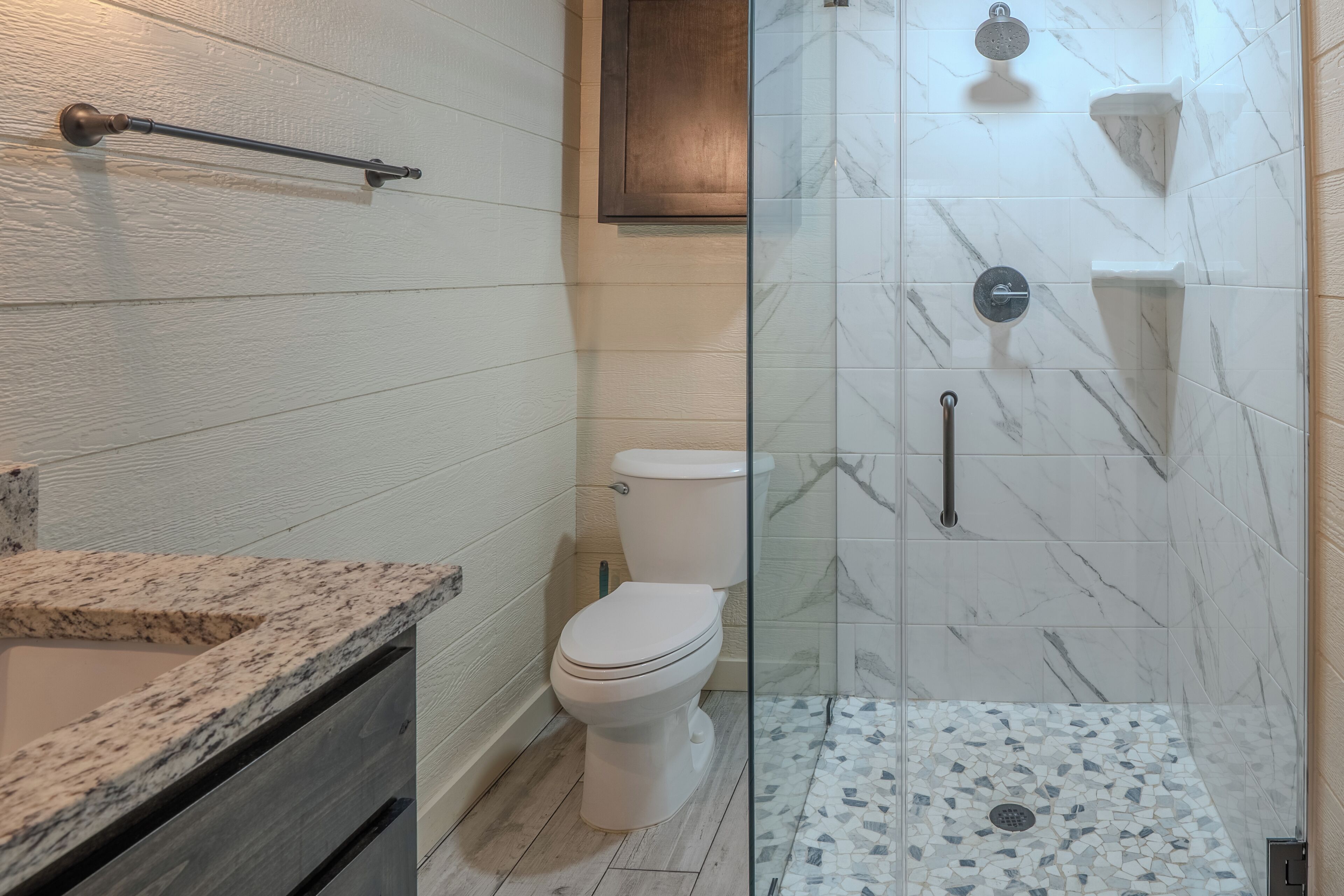 Shower, hair dryer, towels, toilet paper