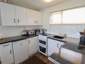 Fridge, electric kettle, toaster, cookware/dishes/utensils