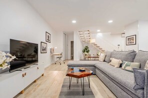 Basic Apartment, Multiple Beds | Living area | TV - Tanoeiros Residence by An Island Apart (Funchal)