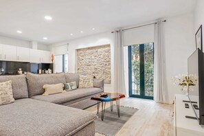 Basic Apartment, Multiple Beds | Living area | TV - Tanoeiros Residence by An Island Apart (Funchal)