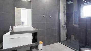 Shower, towels, soap, toilet paper