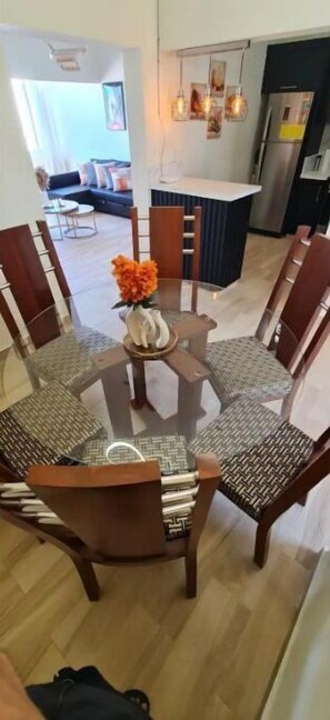 Enjoy meals in this stylish dining area with a round table and six comfortable chairs.