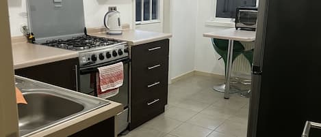 Fridge, oven, electric kettle, toaster