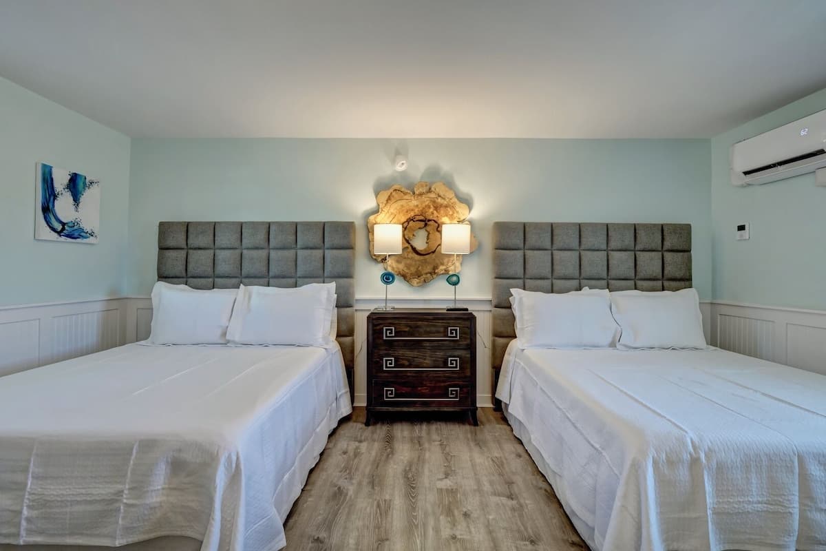 Standard Room, 2 Queen Beds, Refrigerator & Microwave | Living area | 36-inch flat-screen TV with premium channels