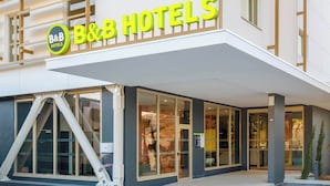 The exterior of B&B Hotels with a modern facade, large glass windows, and a prominent entrance. - B&B HOTEL Nice Stade Riviera (Nice)