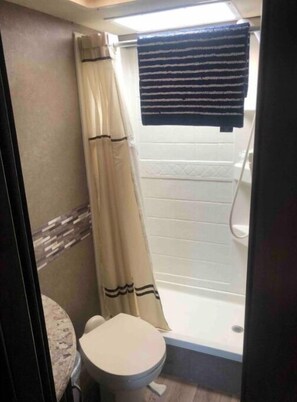 Shower, hair dryer, towels, soap