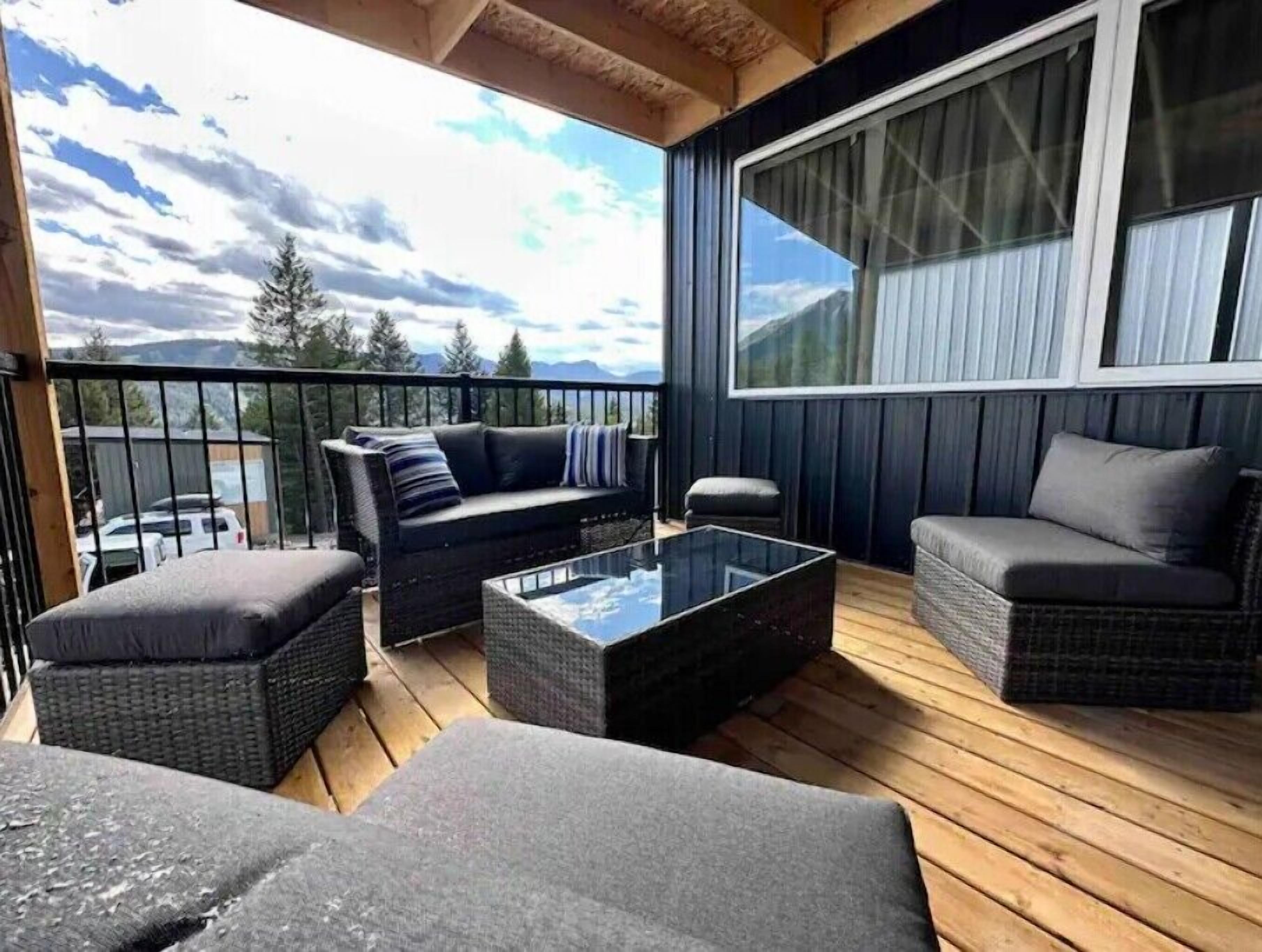 Covered deck overlooking the mountains. That's Pass Powderkeg across the valley.