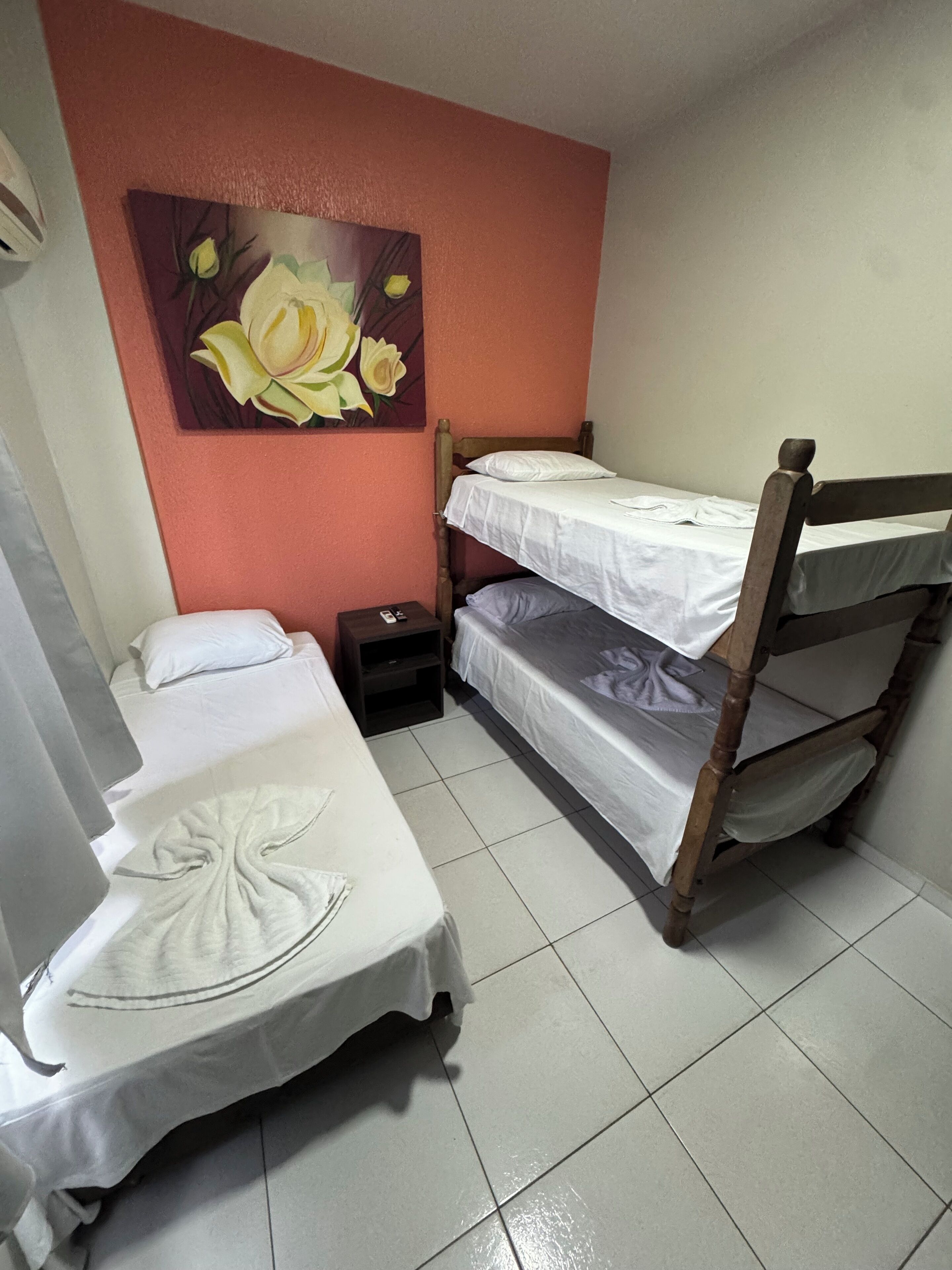 Desk, laptop workspace, iron/ironing board, bed sheets