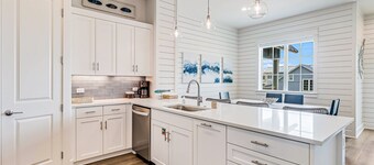 Three-story townhouse with a balcony, two living areas, & a washer/dryer