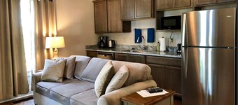 3 bedrooms include a king and two queen size beds, 2 bathrooms, and kitchenette.
