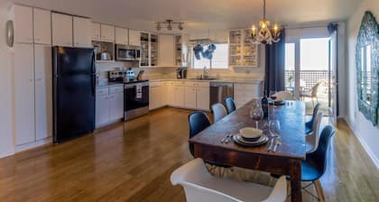 Cottage offers a sectional sofa, chef's kitchen and open floor plan.