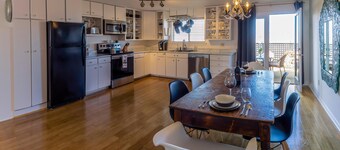 Cottage offers a sectional sofa, chef's kitchen and open floor plan.