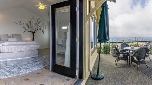 Cottage offers a sectional sofa, chef's kitchen and open floor plan.