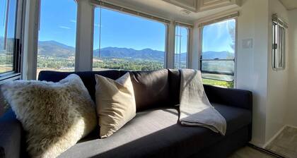 Cottage features a queen-sized bed, dining area, and full kitchen.