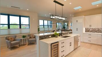 Fridge, microwave, stovetop, coffee/tea maker