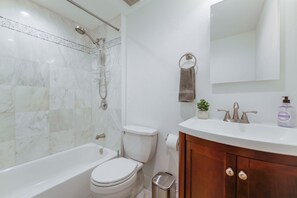 Deluxe House | Bathroom | Rainfall showerhead, hair dryer, towels, soap - Peaceful Comfort: Comfortable Miami Home (Miami)
