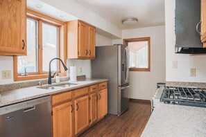 Fridge, microwave, oven, stovetop - TC Lake House w/Hot Tub, Pontoon, & Game Room! (Traverse City)