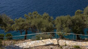A coastal view with a stone pathway leading to a railing overlooking the sea. - Sea View Villa Selina with private sea access and infinity pool (Sivota Lefkada)