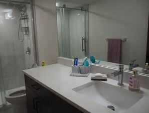 Towels, soap, shampoo, toilet paper - Cozy and Modern Suite Near Airport
 (Calgary)