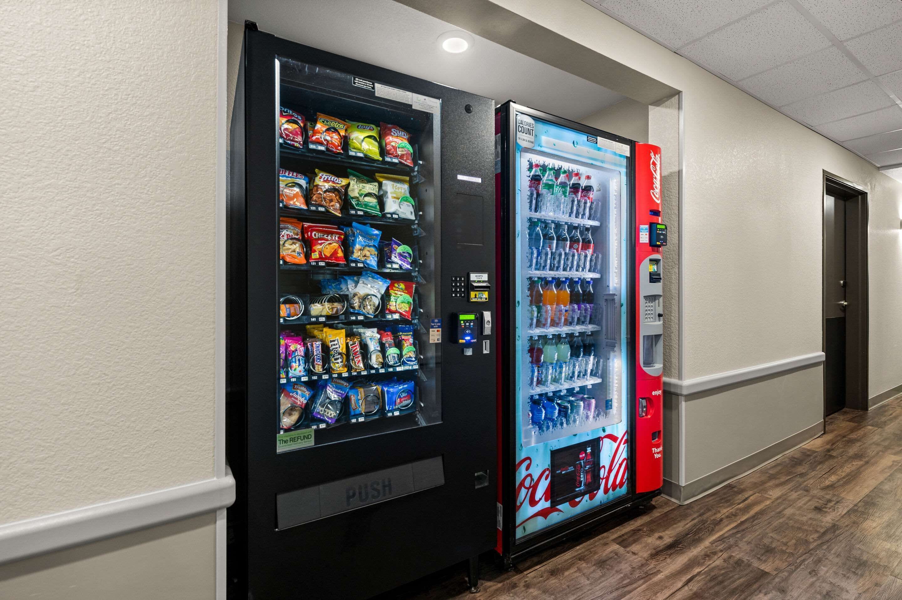 A hallway with vending machines offering snacks and beverages.
