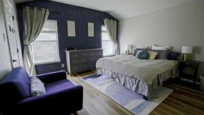 A bedroom with a bed, dresser, chair, and a window with curtains. - Ideally Located, Stone Oak Extended Family Stay (San Antonio)